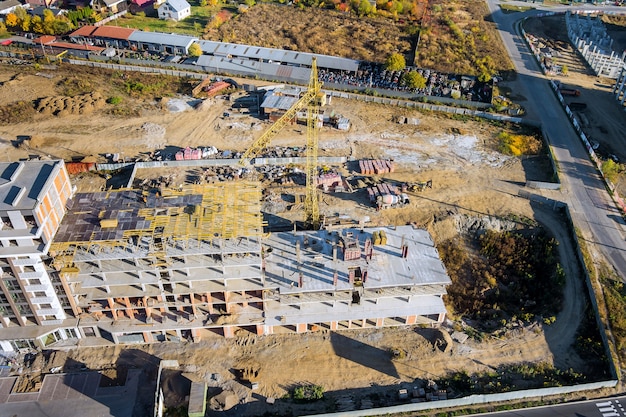 Construction of residential high rise building with a tower crane.