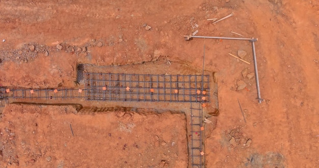 On a construction site steel is placed in a trench for the foundation