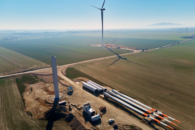 Construction site with windmill turbine parts on ground