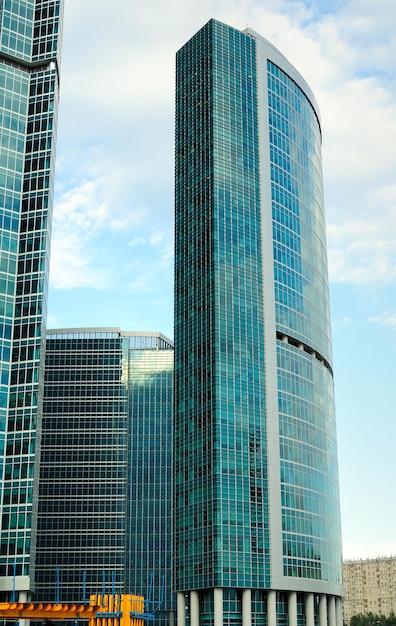 Construction of skyscrapers from glass, a steel and concrete of a complex of the business centre