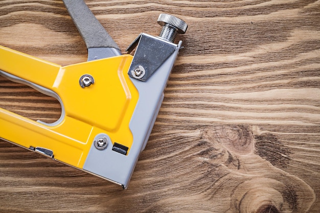 Photo construction staple on wooden board top view maintenance concept