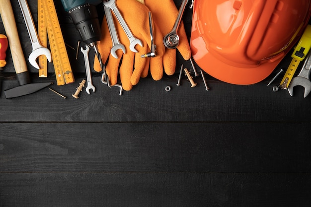 Construction tools on table, space for text