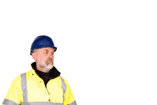 A construction worker in a blue hat and yellow hiviz coat on white background with cpace for text