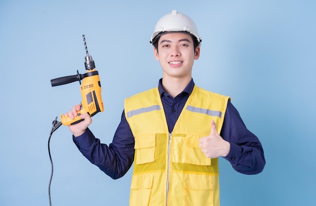 Construction worker portrait on blue background