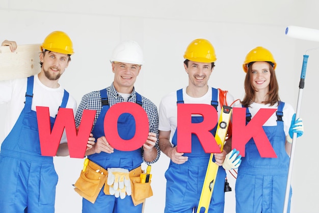 Construction workers with work letters