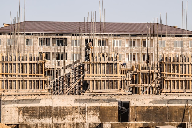 Construction workers working on scaffolding