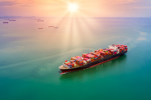 Container cargo logistics shipping transportation and the sunset over aerial view