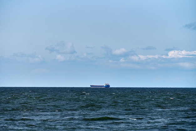 Container cargo ship, import export business trade logistic and transportation, container cargo ship boat in open blue sea. Freight shipping maritime, freight transportation, nautical vessel