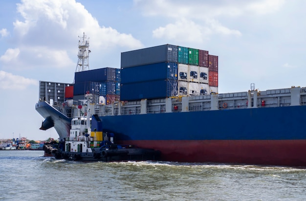 Container Cargo ship with tugboat