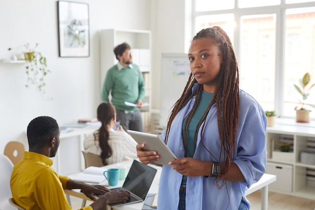 contemporary African-American woman with multi-ethnic business team