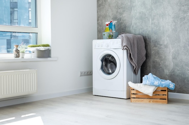 Contemporary luxury laundry in a brand new apartment in white.