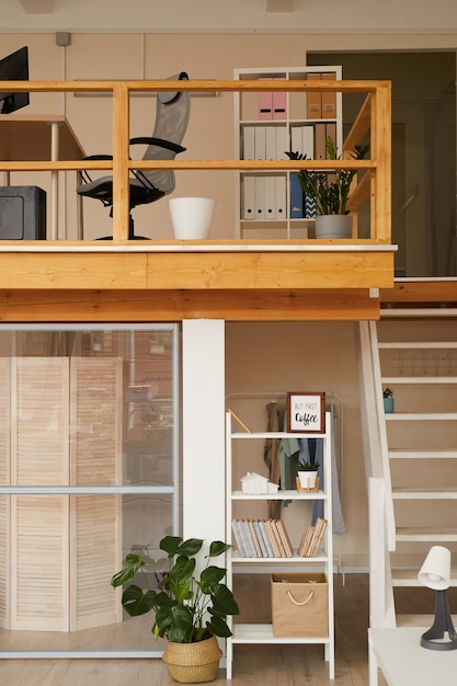 contemporary two level apartment interior with home office workplace on top level