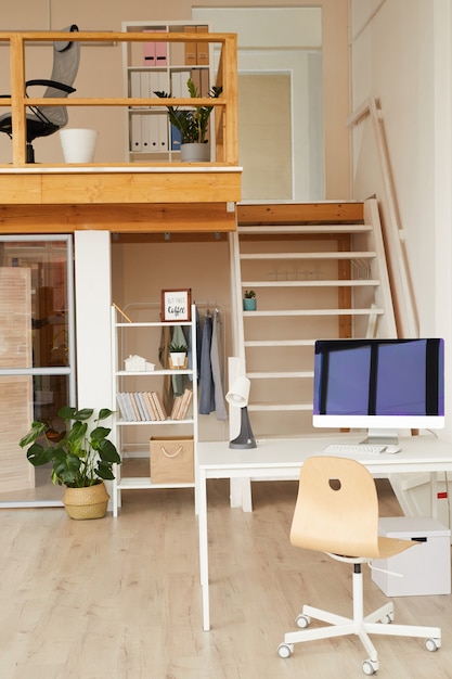 contemporary two level office space with computer desk in foreground