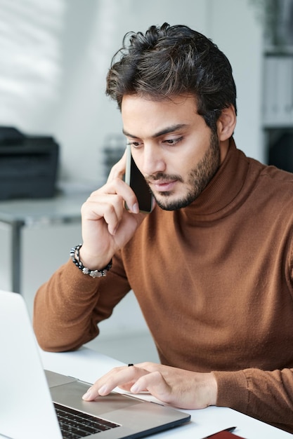 Content businesswoman scrolling through phone