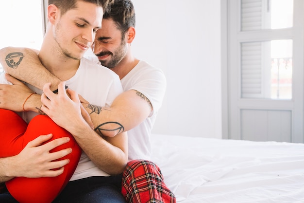 Content men embracing in love