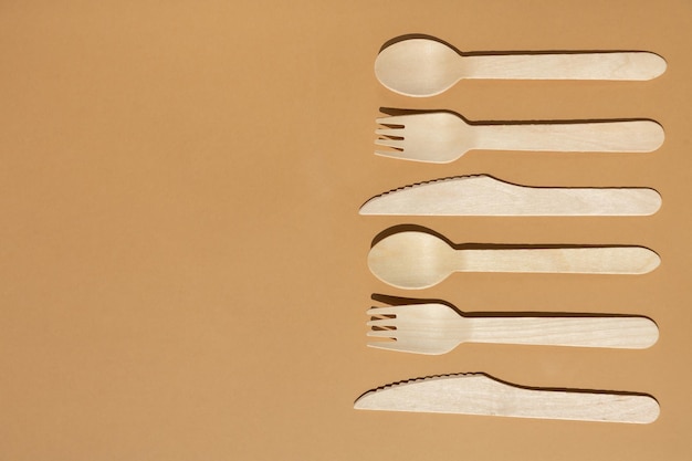 Contrast lighting Flat lay Eco friendly wooden cutlery Fork and knife spoon Plastic Free Concept