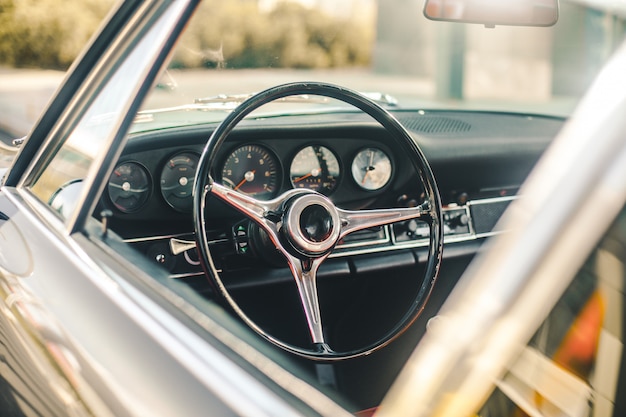 Control panel of a retro car, view through window