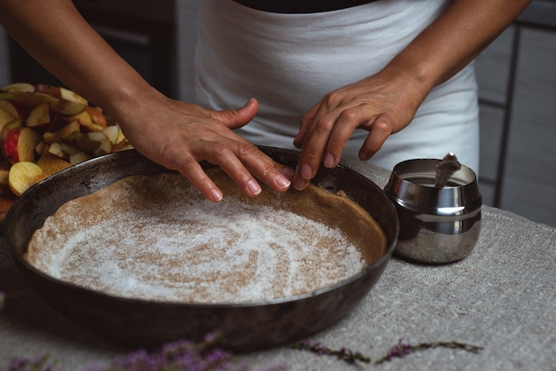 Cook evenly spreads the sugar grains over the surface of the dough