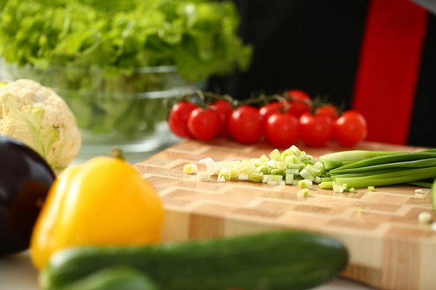 Cook holds knife in hand and cuts on