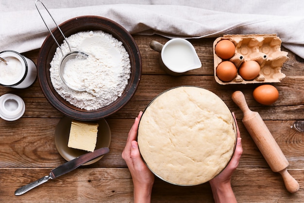 The cook makes dough next to the ingredients