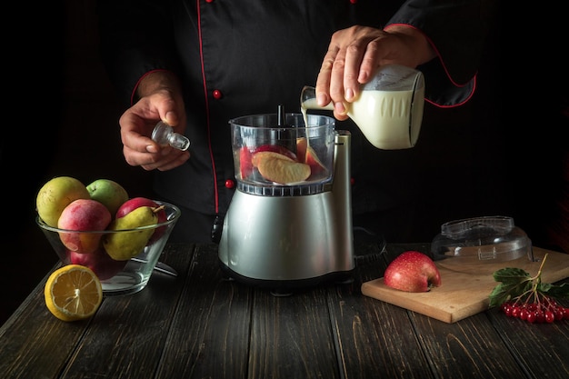 The cook pours milk from a glass jug Delicious diet breakfast idea