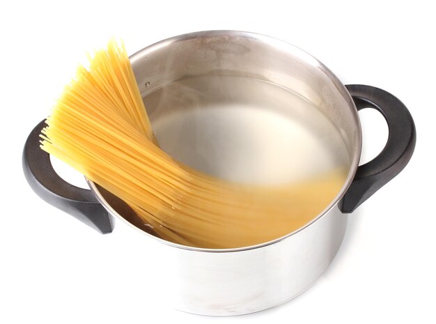 Cook the spagetti in the pan on white background closeup