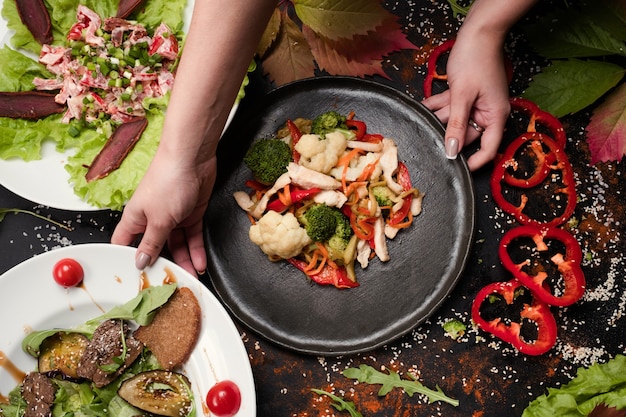 Cook working process ready made salads