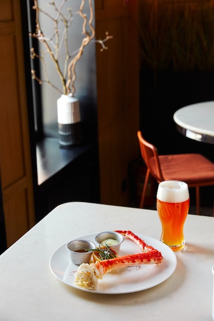 Cooked crab seafood with sauces beer on the table in the restaurant