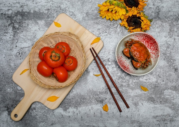 Cooked crab with persimmons and sunflowers