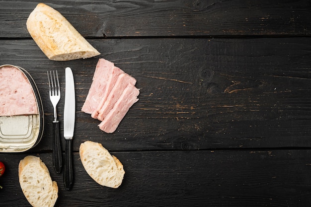 Cooked Ham from the can bread sandwich set, on black wooden table background, top view flat lay, with copy space for text