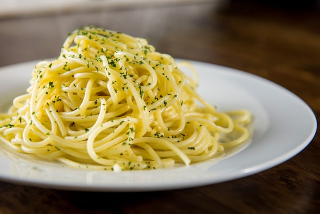 Cooked Italian spaghetti seasoning with ground parsley