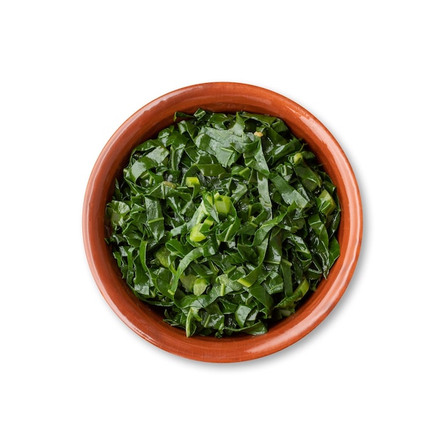 Cooked kale strips typical brazilian feijoada sidedish in a bowl isolated over white background