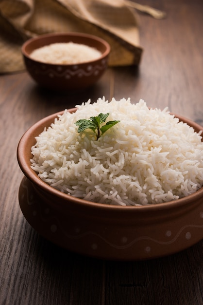 Cooked plain white basmati rice in terracotta bowl