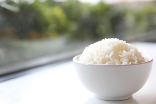 Cooked rice in bowl isolated in white background