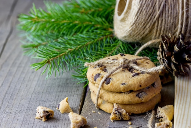 Cookies decorated with twine with Christmas fir branches