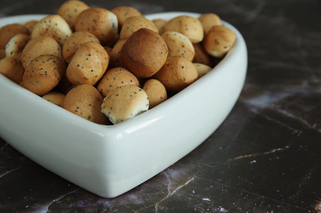 cookies Kuciukai in a heart shaped plate.