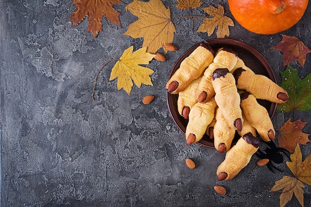 Cookies witch fingers, funny recipe for Halloween party. Top view. Flat lay