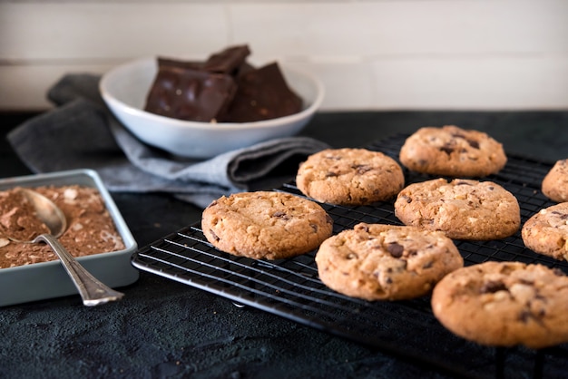 Cookies with chocolate chips on metal grill