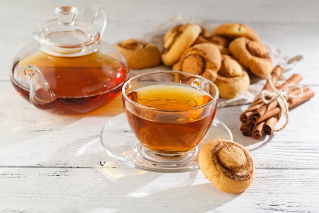 Cookies with cinnamon and tea on a table, selective focus, copy space