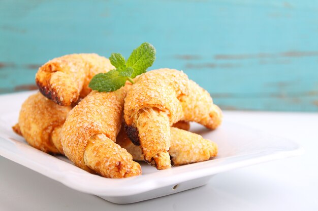 Cookies with jam on a white plate on a white background