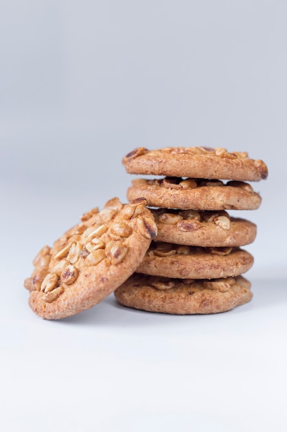 Cookies with nuts on a white wall, Delicious cookies on a white wall