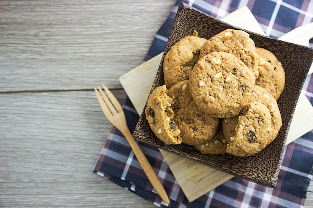 Cookies in a wooden bowl A Fork near