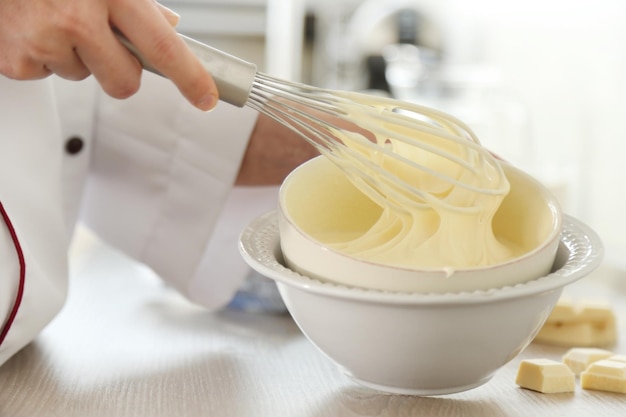 Cooking buttery cream on kitchen