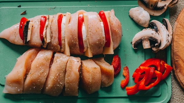 Cooking chicken french with vegetables on baking tray