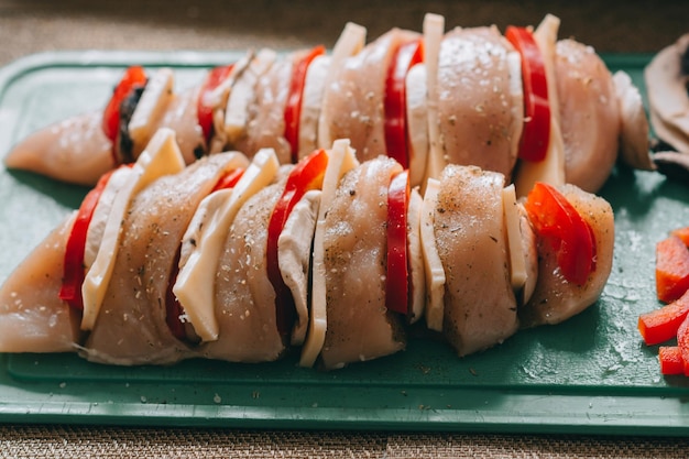 Cooking chicken french with vegetables on baking tray