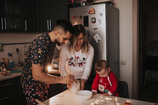 Cooking Christmas cookies with icing. Family