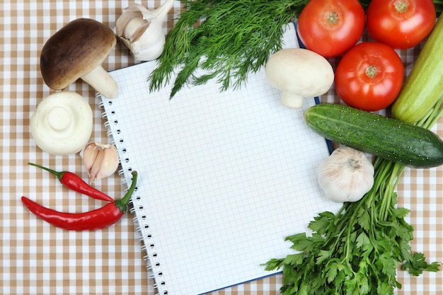 Cooking concept Groceries with empty cookbook close up