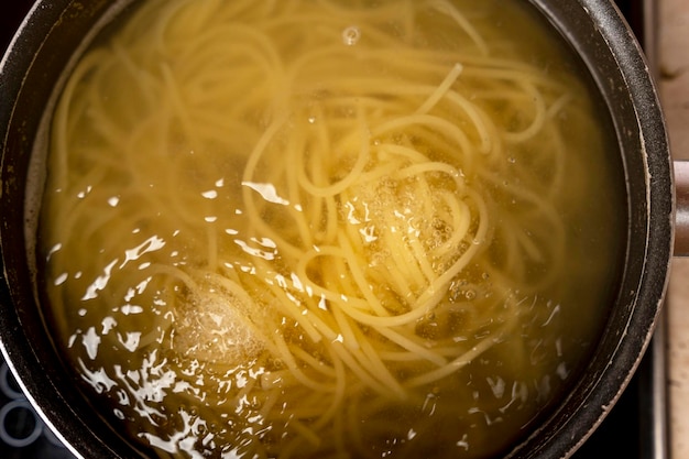 Cooking delicious spaghetti in boiling water