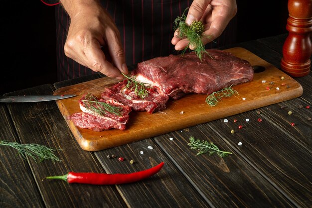 Cooking delicious veal by the chef hands in the kitchen Menu idea for a restaurant or hotel