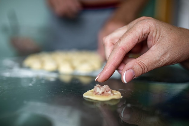 cooking dumplings from dough and minced meat closeup